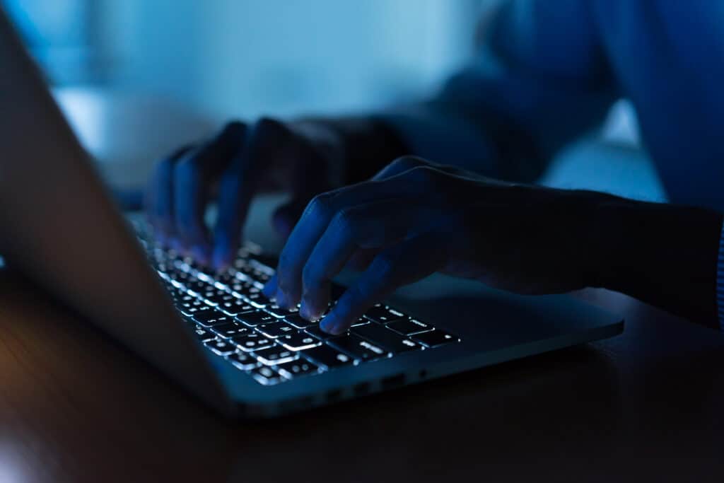 person typing on keyboard person typing on keyboard
