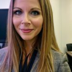 Enhanced professional woman in conference room, cosn event, educational technology expert, digital learning, networked learning environment, conference setting.